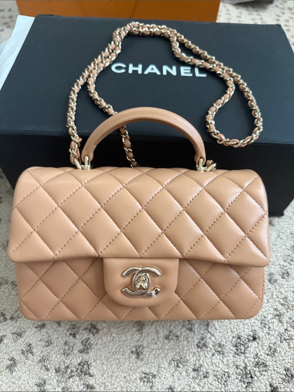 Chanel Mini Rectangle Top Handle in dark beige.
